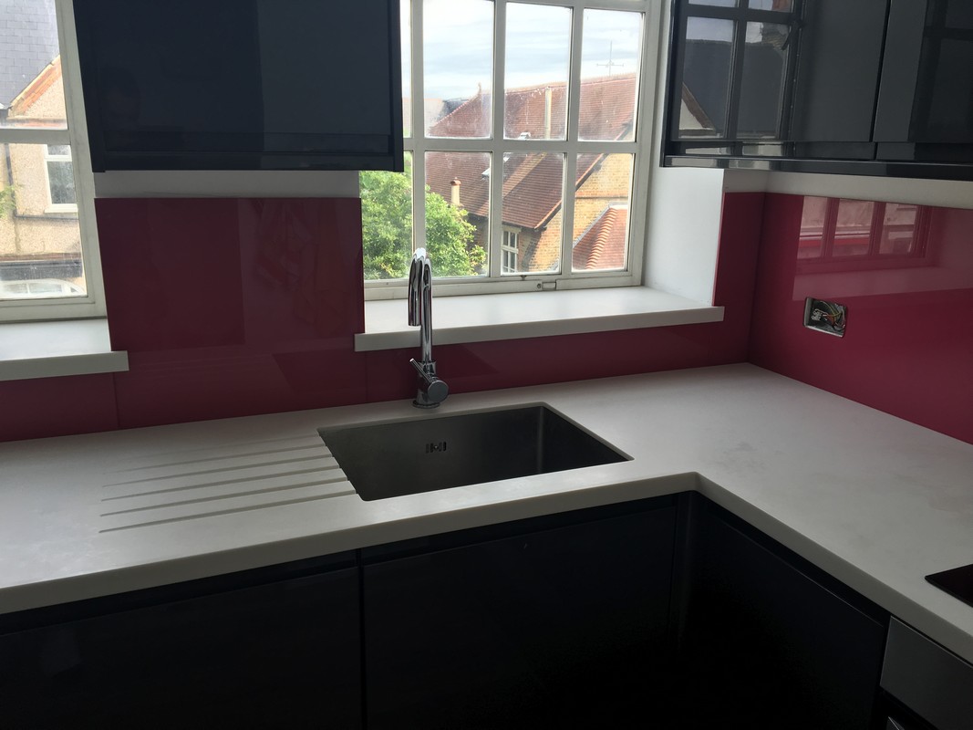 Deep plum coloured glass splashback in modern Harpenden kitchen