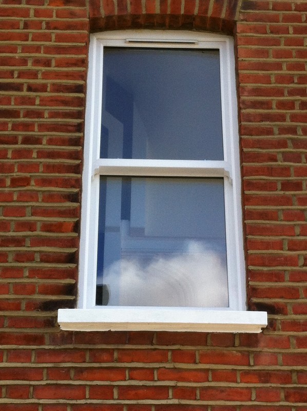 uPVC sash window on Victorian red brick house in Harpenden